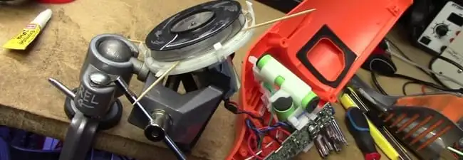 Vacuum cleaner repair parts and tools on a workbench in Irvine, CA