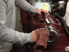 Vacuum repair technician cleaning and servicing a vacuum motor in Irvine, CA