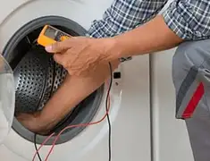 Washing machine repair technician testing a front-load washer with diagnostic tools in Irvine, CA